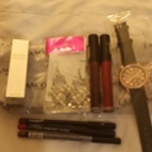 Watch,face cream, earrings, lipsticks and liners b